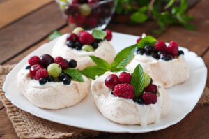 meringue cake pavlova with cream berries