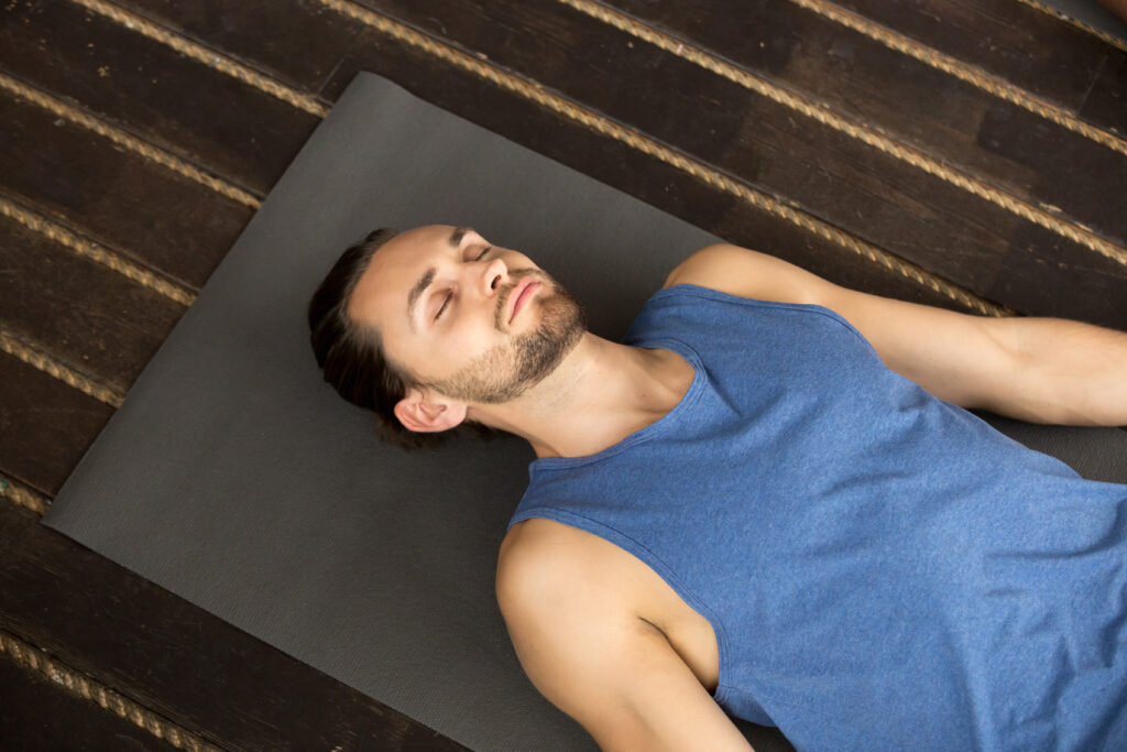 young sporty man lying dead body exercise